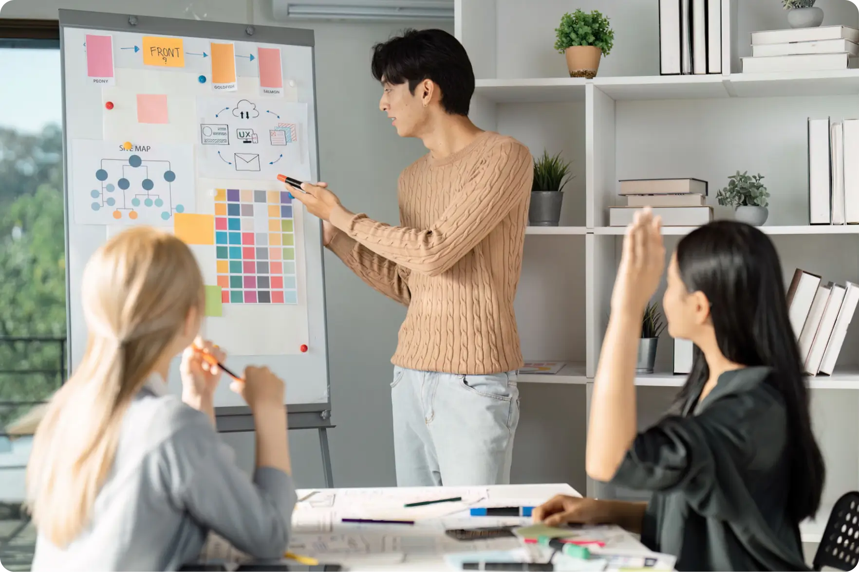 People collaborating on a project with charts.